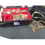 A quantity of vintage costume jewellery and some silver items including a bangle, locket etc.