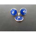 A 9ct gold lapis lazuli and diamond pendant - The circular lapis lazuli panel inset with a