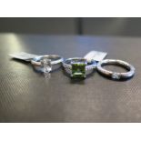 Three gem-set rings - To include topaz, cubic zirconia and peridot - Stamped 925 - Ring sizes L and