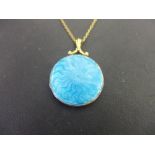 An guilloche enamel locket - Suspended from a belcher-link chain - Test as 9ct gold - Length of