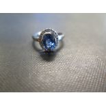 An 18ct gold sapphire and diamond cluster ring - Hallmarked Birmingham - Ring size L 1/2 - Weight