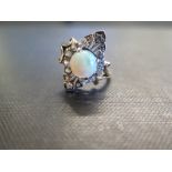 An opal and white-gem dress ring - Tests as 9ct gold - Ring size N - Weight approx 3.4gms
Condition