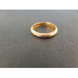 A 22ct gold band ring - With decorative border - Hallmarked Birmingham - Ring size N 1/2 - Weight