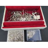 A quantity of mixed silver jewellery to include rings, crosses, ingots, earrings and a large