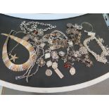 A quantity of silver, vintage and costume jewellery.