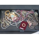 An assortment of vintage, silver and costume jewellery.