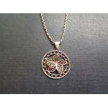 A 9ct gold filigree flower pendant - Partial hallmark - Length 3.5cms - Suspended from a