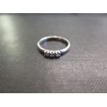 A 9ct gold diamond three-stone ring - Estimated total diamond weight 0.15ct - Hallmarked Birmingham