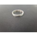 A brilliant-cut diamond full-circle band ring - Believed to be platinum - Ring size L 1/2 - Weight