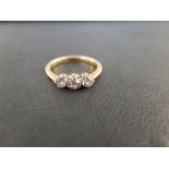 An old-cut diamond three-stone ring - Estimated total diamond weight 0.50ct - Stamped 18ct - Ring