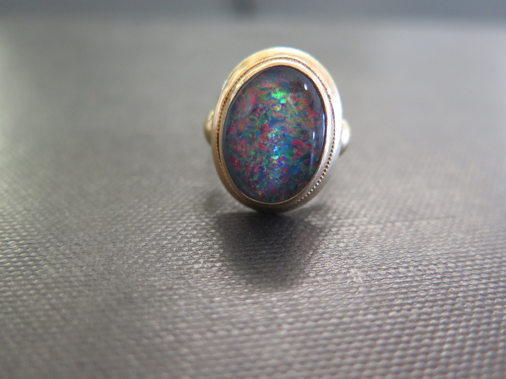 An opal triplet ring - Stamped 18ct - Ring size M 1/2 - Weight approx 6.3gms
Condition Report: Good