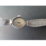 A Ladies steel cased Deco style Tudor wristwatch on a shaped mesh strap, silvered face with baton