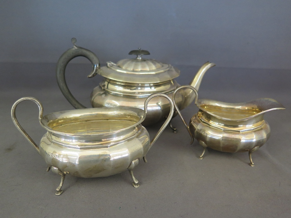 A silver hallmarked teaset - teapot, milk and sugar - teapot bearing hallmark for Sheffield 1956 -