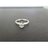 A diamond single-stone ring - The pear-shape diamond to the plain band - Estimated diamond weight