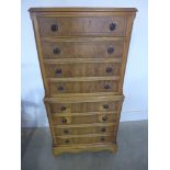 A yew wood chest on chest of eight drawers