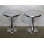 A pair of polished aluminium stools 40cm diameter x 46cm tall