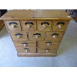 A new pine bank of eleven spice drawers - Height 81 cm x Width 77 cm x Depth 26 cm