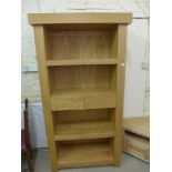 A modern oak John Lewis bookcase with two central drawers - Height 1.