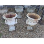 A pair of white painted metal garden urns/planters with scrolling foliate design 45cm diameter x