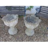 A pair of reconstituted stone planters with foliate decoration - 58cm high x 50cm diameter