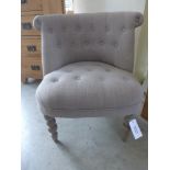 A new upholstered button back bedroom chair