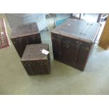 A set of three faux leather storage boxes