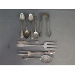 Four Georgian silver fiddle back spoons and a pair of sugar tongs,