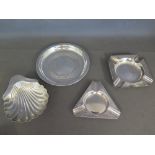 Two silver ashtrays, a silver shell dish and a silver dish - Total weight approx. 6.