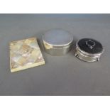 A silver and tortoiseshell dressing table pot or trinket box with silver inlaid to top,