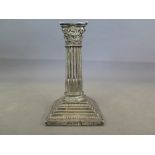 A silver hallmarked candlestick in Corinthian column design, hallmark for 1904-5 Chester,