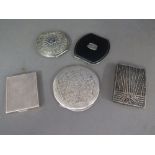 A collection of English and Continental 800 silver and white metal compacts and a filigree white