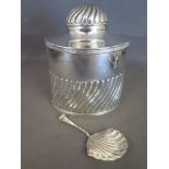 A silver tea caddy - Birmingham 1914/15 G U - George Unite with matching caddy spoon fitting in the