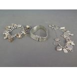 Two silver charm bracelets - one with eleven charms,