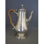 A 18th century silver coffee of baluster form with shell spout and boxwood shaped handle Newcastle