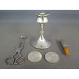 A silver hallmarked candlestick, two silver Birmingham Crowns,