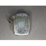 A silver Vesta - Hallmarked Birmingham 1906 - 07 with engraved foliate design