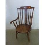 A Windsor armchair with a penny seat