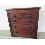 A 19th century mahogany miniature chest