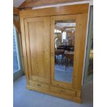 A fully sectional stripped pine two door