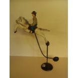 A good rocking Rodeo Cowboy and Horse tin toy - Height 47 cm 
Condition report: Very good with a