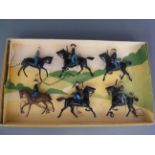 A box containing six soldiers on horseback,