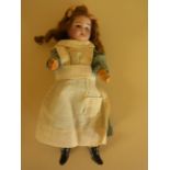An antique Paris SFBJ bisque headed Doll no 60  13/18 - blue dress with white pinafore,