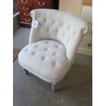 An upholstered bedroom chair