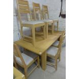 A good quality oak extending dining table with six chairs 85cm x 170cm extended - as new