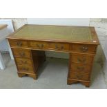 A yew wood effect eight drawer twin pedestal desk 1.