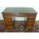 A reproduction figured walnut eight drawer pedestal desk - with a label for Brights of Nettlebed -