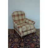 A tartan covered fireside chair