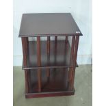 A modern mahogany effect revolving bookcase