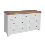 A painted seven drawer wide chest - width 135cm x depth 44cm x height 78cm