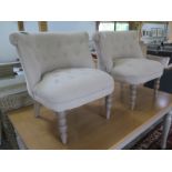 A pair of new button back bedroom chairs